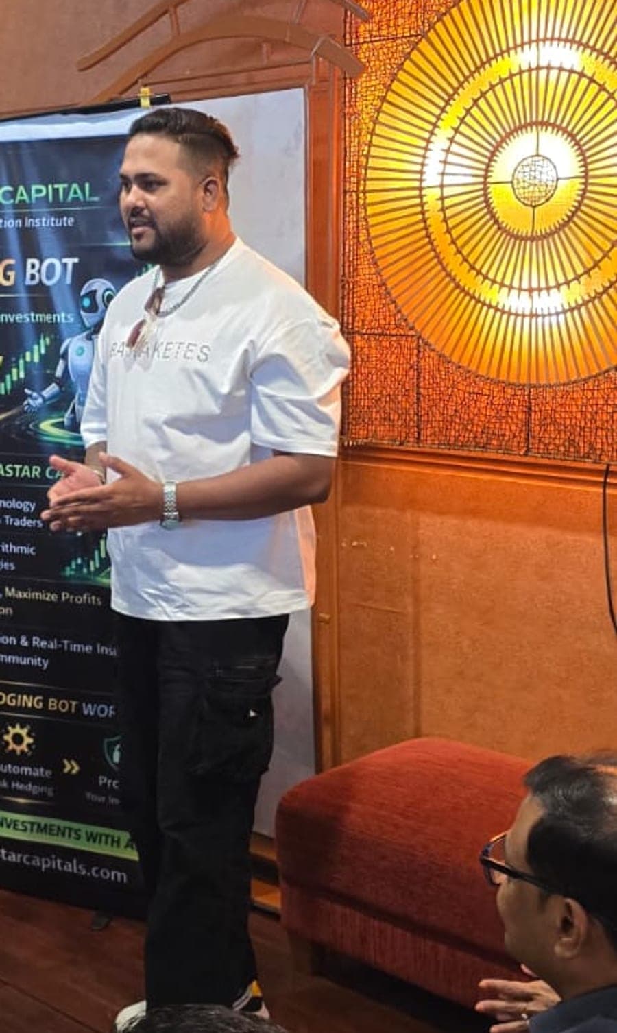 Delivering a live trading seminar to an audience of traders